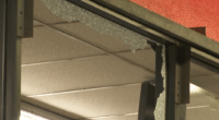 Shattered window at the L.A. AutoZone following the looting
