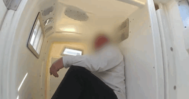 A 59-year-old man in police custody after being arrested for allegedly assaulting a crew member before a flight from Perth to Brisbane took off.