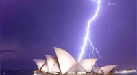 New South Wales was battered last night by an unseasonal storm that unleashed 100,000 lightning strikes across the state.