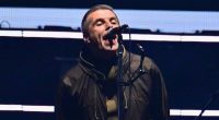 Oasis are back! First look as Liam and Noel Gallagher FINALLY arrive on stage at Cardiff's Principality Stadium and put on very united display as they stand hand-in-hand on first night of reunion tour - 15 years since split