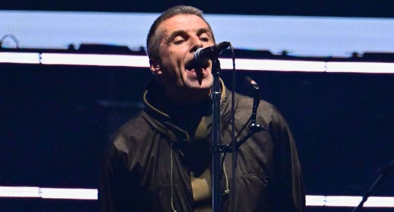 Oasis are back! First look as Liam and Noel Gallagher FINALLY arrive on stage at Cardiff's Principality Stadium and put on very united display as they stand hand-in-hand on first night of reunion tour - 15 years since split