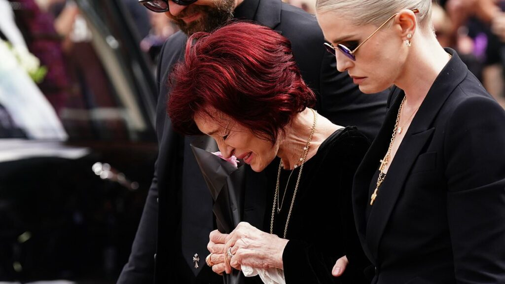 Ozzy Osbourne's family gather to lay him to rest in the grounds of his mansion in front of huge tongue-in-cheek sign with stars including Elton John among mourners