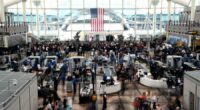 Passengers flee smoking jet on emergency slide after apparent landing gear problem at Denver airport