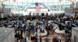 Passengers flee smoking jet on emergency slide after apparent landing gear problem at Denver airport