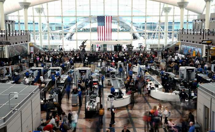 Passengers flee smoking jet on emergency slide after apparent landing gear problem at Denver airport