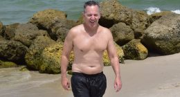 Paunchy Fox News star Greg Gutfeld shows his softer side as he soaks up sun with wife and newborn daughter