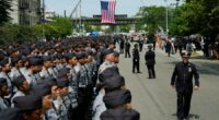 Police and dignitaries pay tribute to the officer killed in New York office shooting