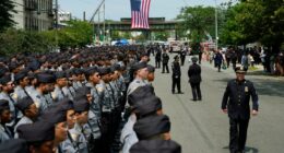 Police and dignitaries pay tribute to the officer killed in New York office shooting