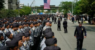 Police and dignitaries pay tribute to the officer killed in New York office shooting