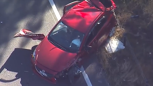 An early-morning police chase has ended with a man wanted over alleged domestic violence ejected from his car and fighting for his life in a Sydney hospital.﻿