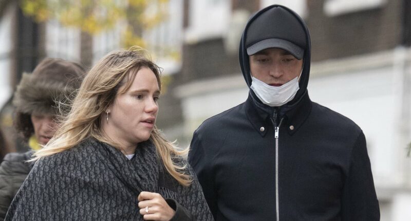 Pregnant Suki Waterhouse sparks engagement rumours as she shows off stunning diamond ring during a stroll with partner Robert Pattinson - ahead of welcoming their first child