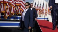 Secret Service agent suspended over Trump assassination attempt is unmasked... as widow of firefighter killed blasts agency