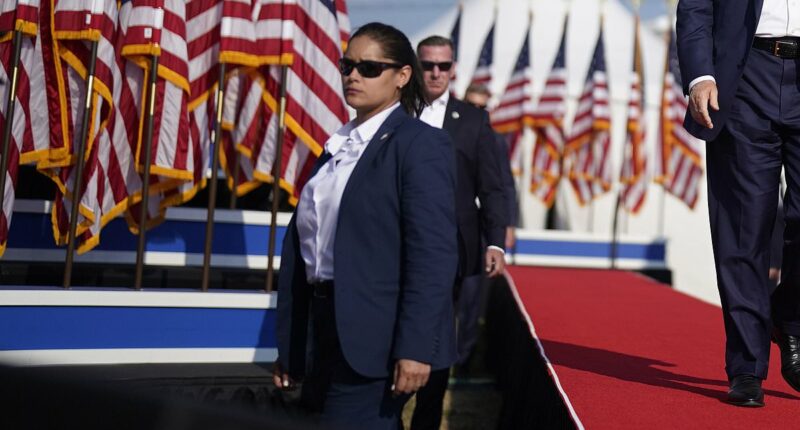Secret Service agent suspended over Trump assassination attempt is unmasked... as widow of firefighter killed blasts agency