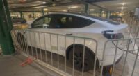 A Tesla in an Adelaide shopping centre car park has been locked up in a cage after the vehicle overstayed its welcome.
