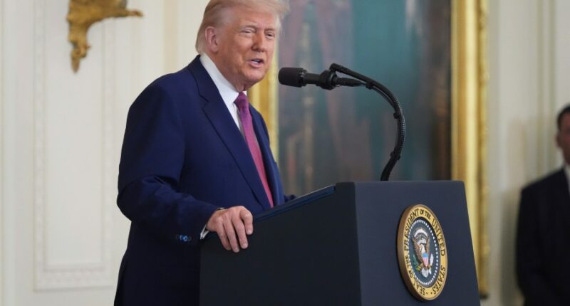 Six months into term, Trump touts 'revived' US as approval dips