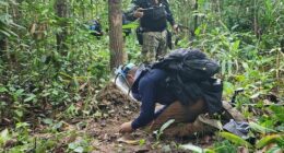 Thai forces examine a landmine near the Cambodian border.