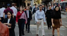 Pedestrians and office workers walk through the Sydney CBD.