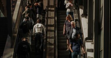 Pedestrians and office workers walk through the Sydney CBD.