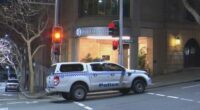 A woman has been charged with allegedly stabbing her coworker with scissors in what police have described as a﻿ "frenzied" attack at a luxury hotel in Sydney CBD.
