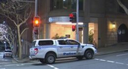 A woman has been charged with allegedly stabbing her coworker with scissors in what police have described as a﻿ "frenzied" attack at a luxury hotel in Sydney CBD.
