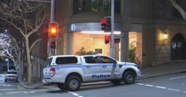 A woman has been charged with allegedly stabbing her coworker with scissors in what police have described as a﻿ "frenzied" attack at a luxury hotel in Sydney CBD.