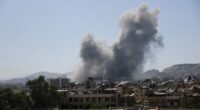 Smoke rises after strikes on Syria's defence ministry in Damascus on July 16.