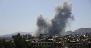 Smoke rises after strikes on Syria's defence ministry in Damascus on July 16.