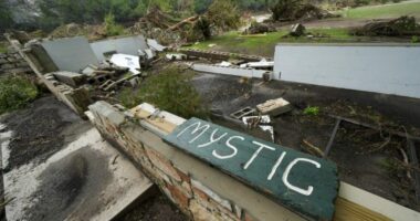 A Camp Mystic sign is seen near the entrance to the establishment along the banks of the Guadalupe River in Hunt, Texas, Saturday, July 5, 2025, after a flash flood swept through the area. (AP Photo/Julio Cortez)