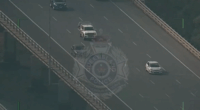 Two men who led police on a chase have been charged after they were found hiding in barrels in an abandoned shed north of Brisbane.