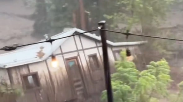 Watch: New Mexico flash flood sweeps house away
