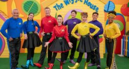 The Wiggles' modern lineup, including Anthony Field (left) and the first woman of colour in the main cast Tsehay Hawkins (right).