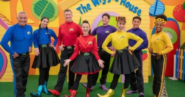 The Wiggles' modern lineup, including Anthony Field (left) and the first woman of colour in the main cast Tsehay Hawkins (right).