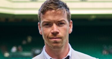 Will Poulter wears wonky trousers and odd socks for Wimbledon