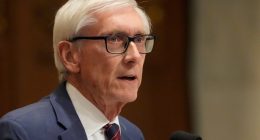 Wisconsin's Democratic governor reaches budget deal with Republicans to cut taxes, fund university