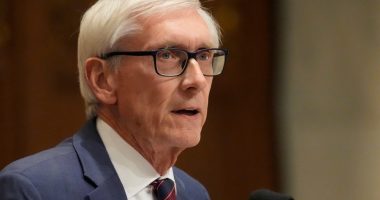 Wisconsin's Democratic governor reaches budget deal with Republicans to cut taxes, fund university