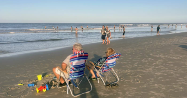 ‘You just got to be careful’: Swimmers take to New Smyrna Beach after shark bite