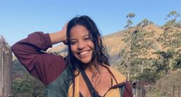 Juliana Marins smiling in front of a hillside.
