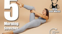 Brunette is engaged in fitness. Beautiful young woman in gray tight-fitting yoga suit does exercise on neutral beige background, she lies on her back and raises her knee to her chest, side view. 5 Bedroom Stretches That Boost Energy More Than Coffee After 50. Cover