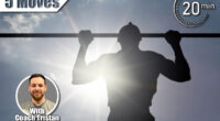 Silhouette of a young man doing pull-up exercise on a horizontal bar against a blue cloudy sky with sun flare. 5 Classic Exercises That Build More Strength Than CrossFit After 50. Cover