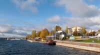 People walking along the bank of Saimaa Lake in Puumala, Finland.