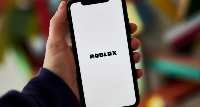 Smartphone displaying the Roblox logo.