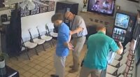 Chilling moment murder suspect is arrested while having his hair cut