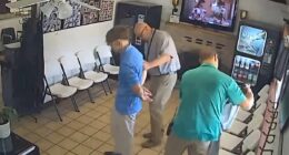 Chilling moment murder suspect is arrested while having his hair cut