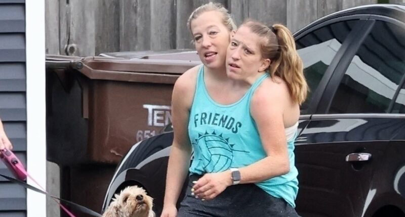 Conjoined twins Abby and Brittany Hensel step out after baby buzz