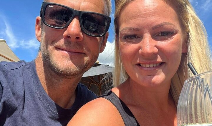 Photo of a couple outdoors.