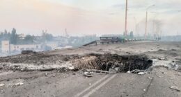 Damaged road bridge in Kherson, Ukraine, after a Russian attack.