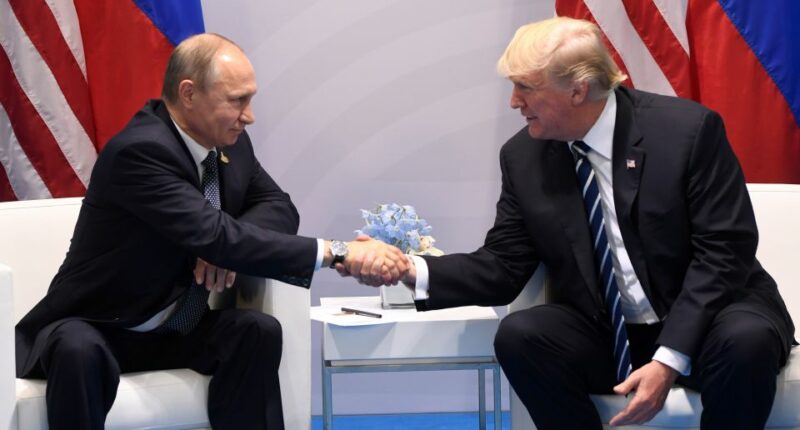 Presidents Trump and Putin shaking hands at a summit.