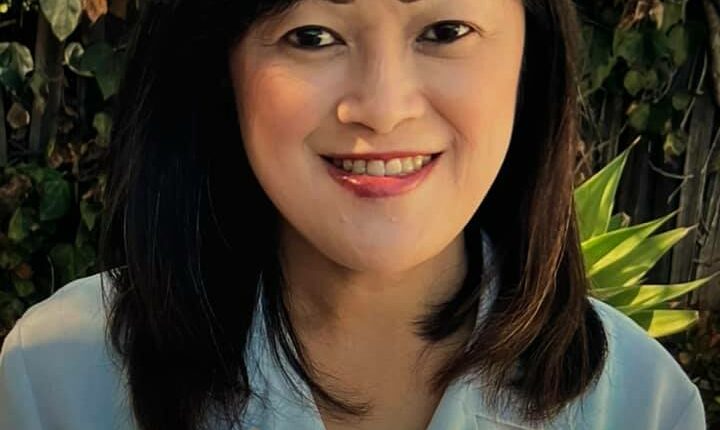 Headshot of Irene T. Gaw Gonzalo, D.O. in a white coat.