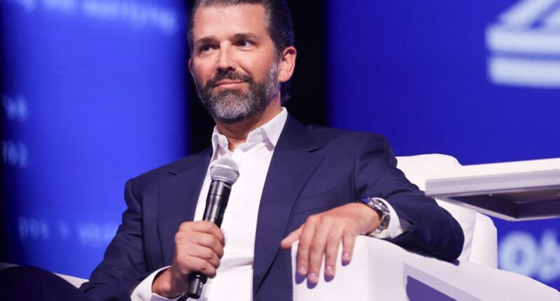 Donald Trump Jr. speaking at a conference.