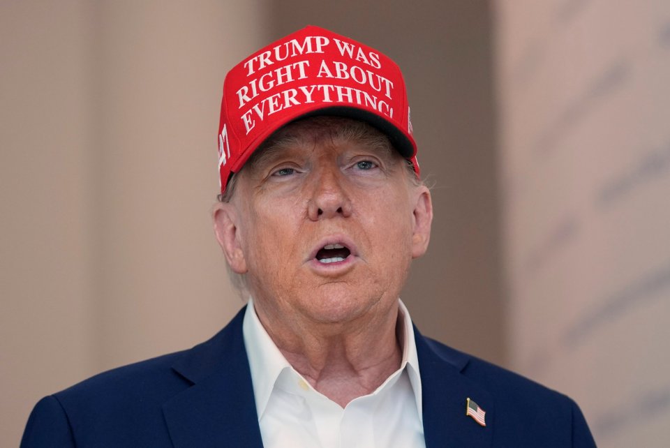 Donald Trump speaking at The People's House museum, wearing a red hat that reads "Trump Was Right About Everything".